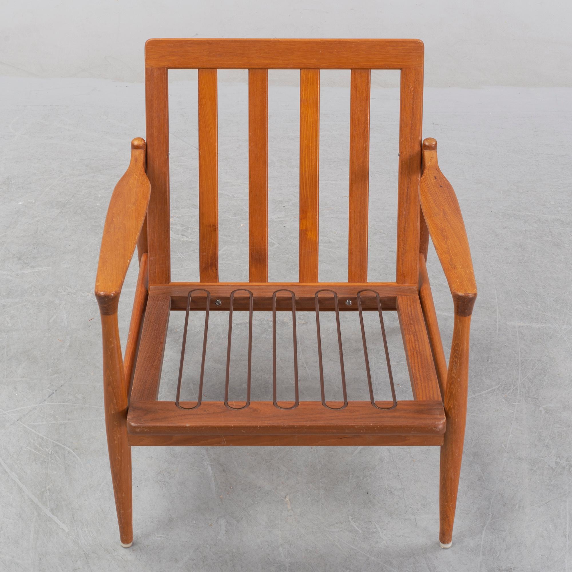 A 1950's/60's teak and oak easy chair.