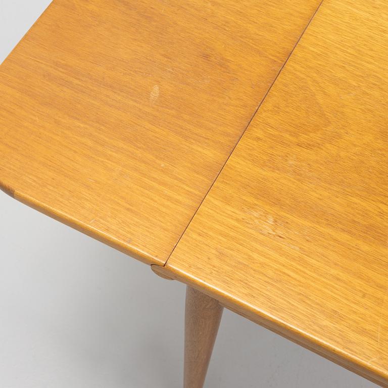 Josef Frank, a model 1007 mahogany drop leaf table, Svenskt Tenn, Sweden, second part of the 20th Century.