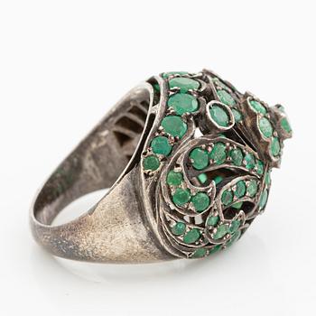 Silver ring with green stones.