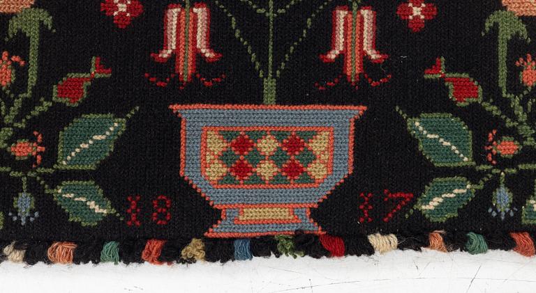 Åkdyna, korsstygnsbroderi, daterad 1817.