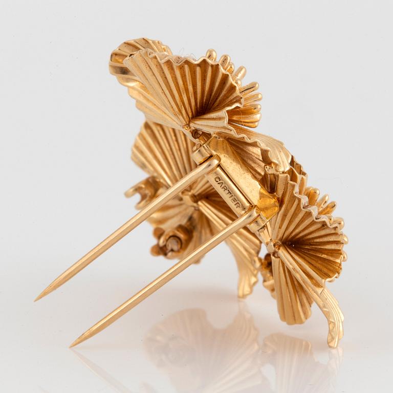 A Cartier brooch in 14K gold.