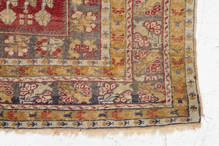 An oriental carpet, c. 195 x 70 cm.