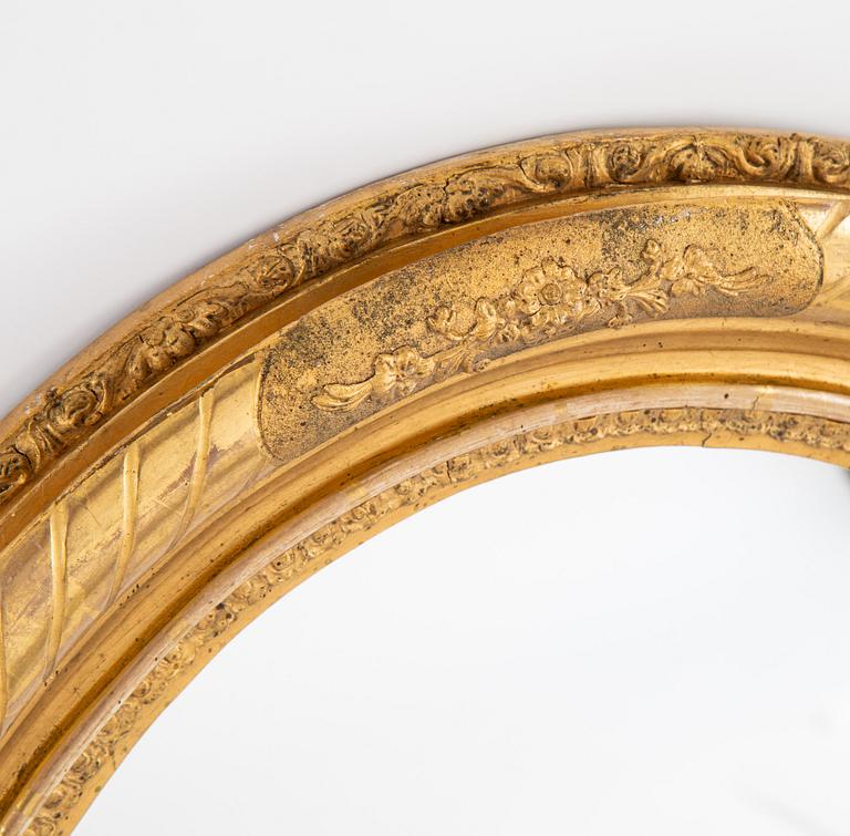 An oval mirror from around the year 1900.