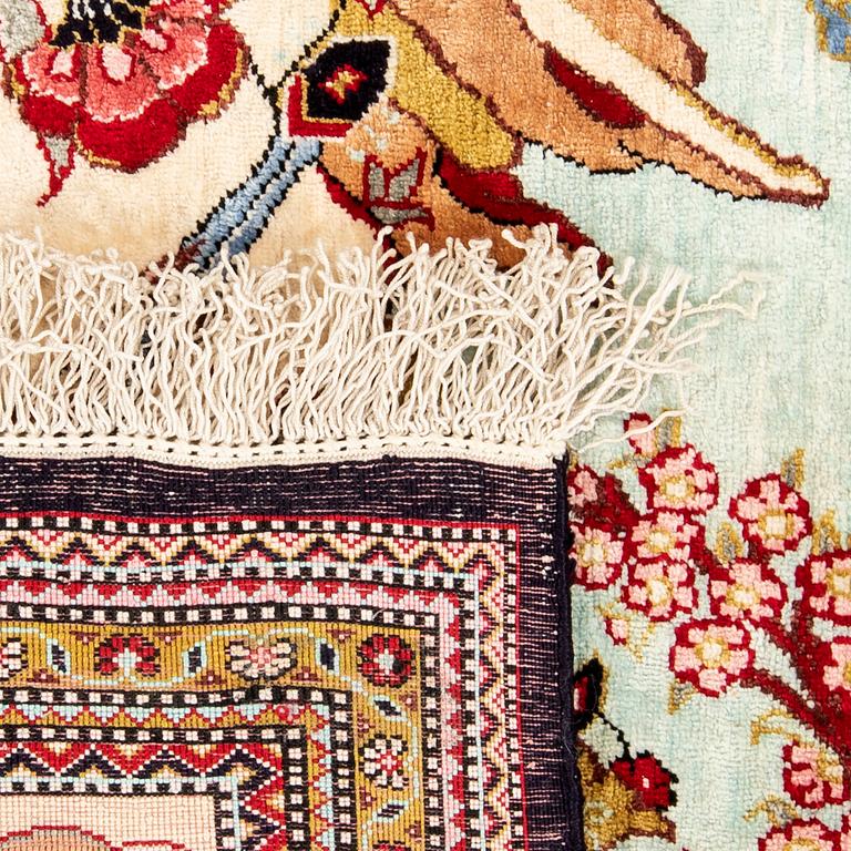 Oriental figural silk rug, approximately 57x79 cm.