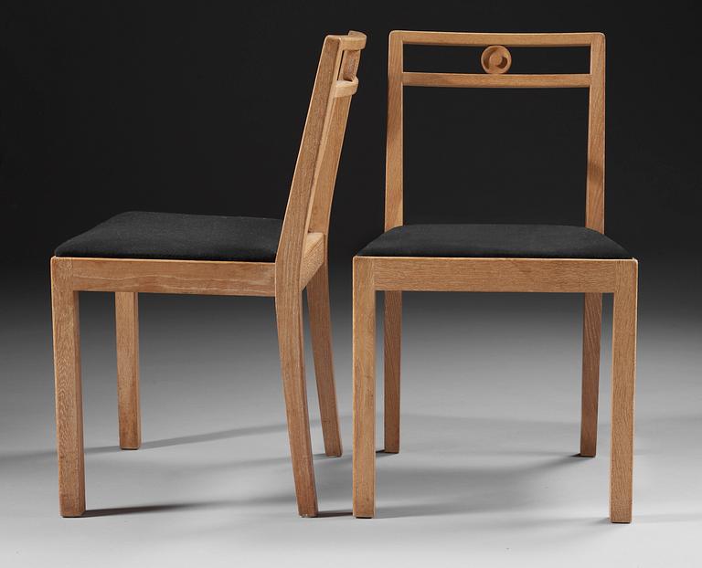 A pair of Axel-Einar Hjorth white chalked oak chairs 'Dagmar' by NK, Sweden 1935.