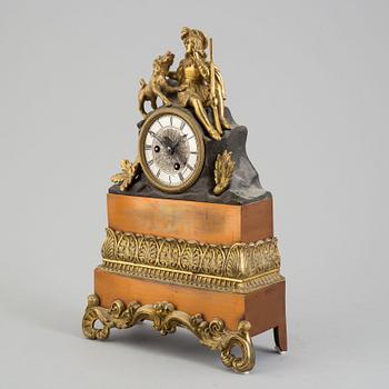 An early 20th century bronze and copper rococo style mantle clock,