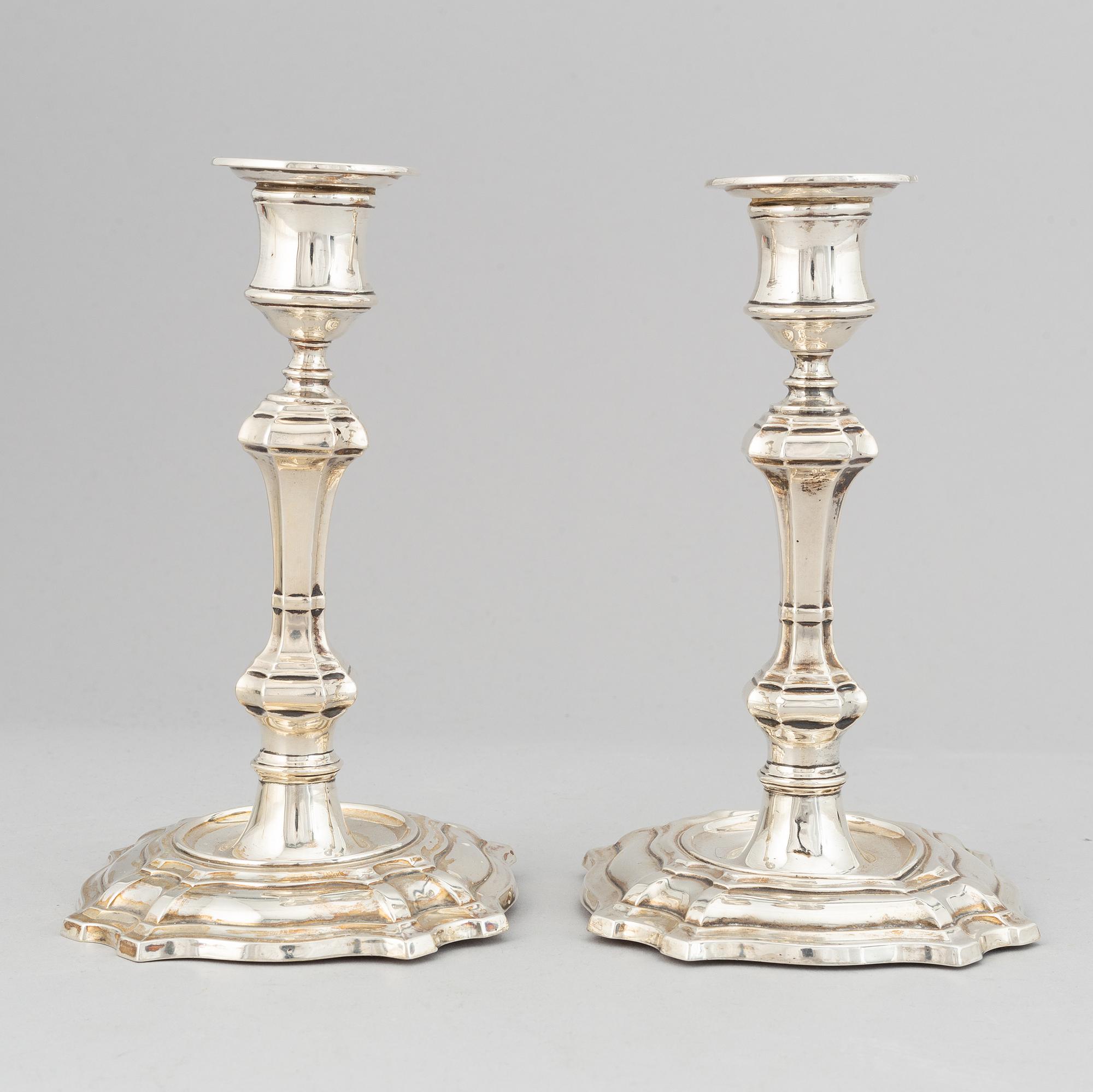 A pair of silver candlesticks, mark of William Hutton & Sons Ltd, London 1900.