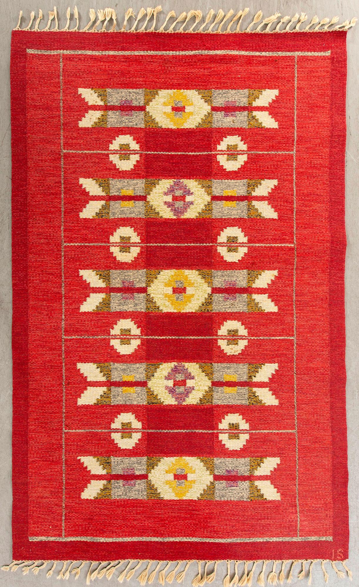 A Swedish flat weave rug signed IS ca 240 x 169 cm.
