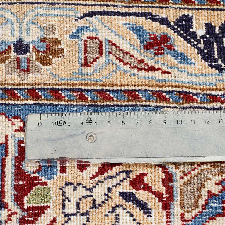 A Nain rug, part silk, 390 x 287 cm.