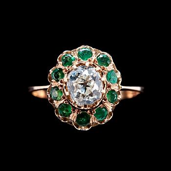 118. A RING, old cut diamond c. 0.70 ct and emeralds.