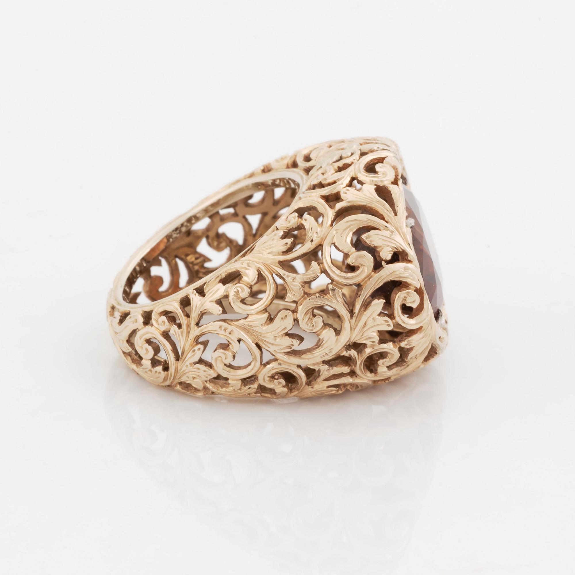 A Tina Karlsson 18K gold ring set with a faceted zircon.