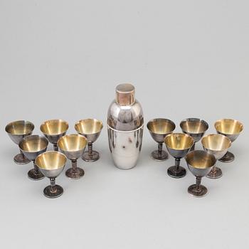 A silverplated shaker and 12 cocktail glasses from GAB and and a Shaker from CG Hallberg, Stockholm mid 20th century.