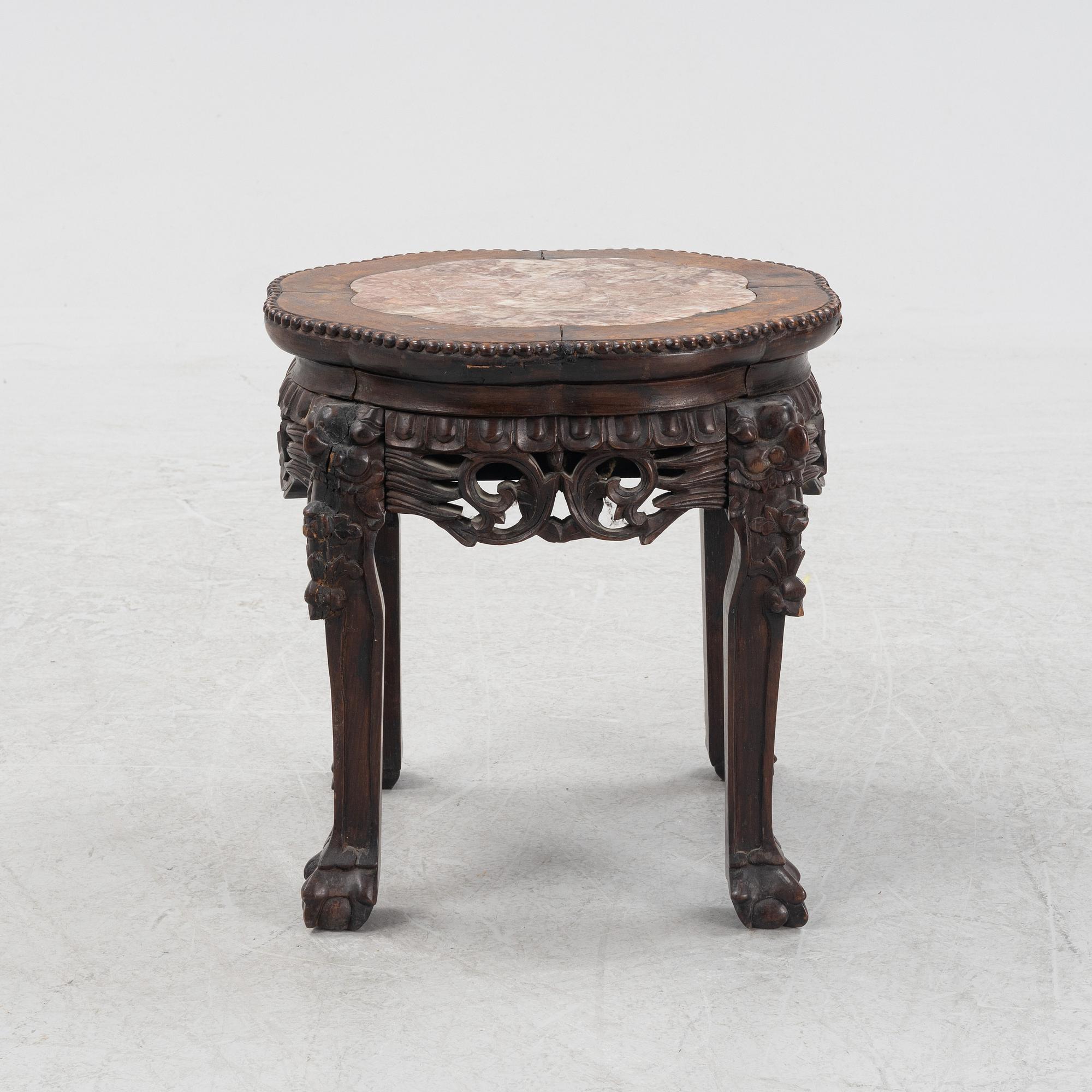 A Chinese hardwood stool, 20th Century.