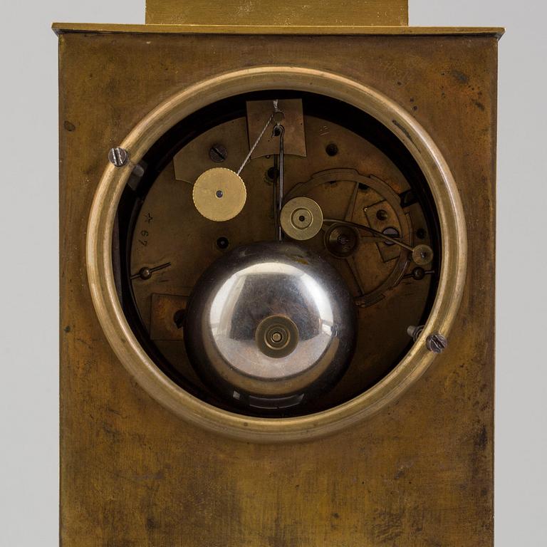 AN EMPIRE MANTEL CLOCK, first half of the 19th century.