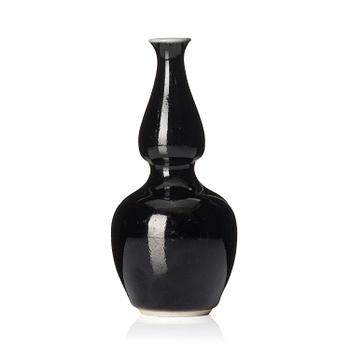 1225. A calebass shaped black glazed vase, Qing dynasty, 19th century.