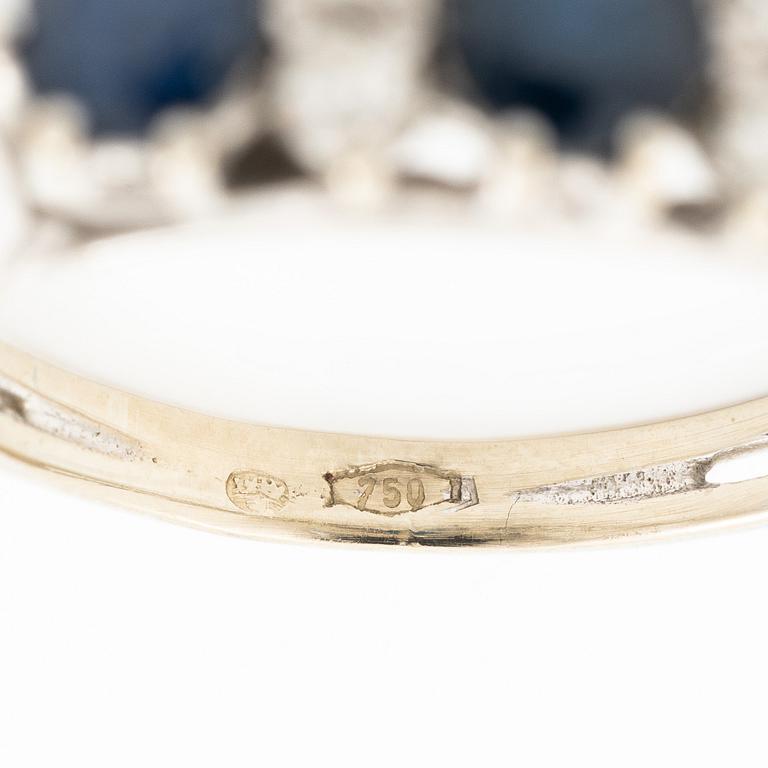 Ring, 18K white gold, set with three sapphires and single-cut diamonds.