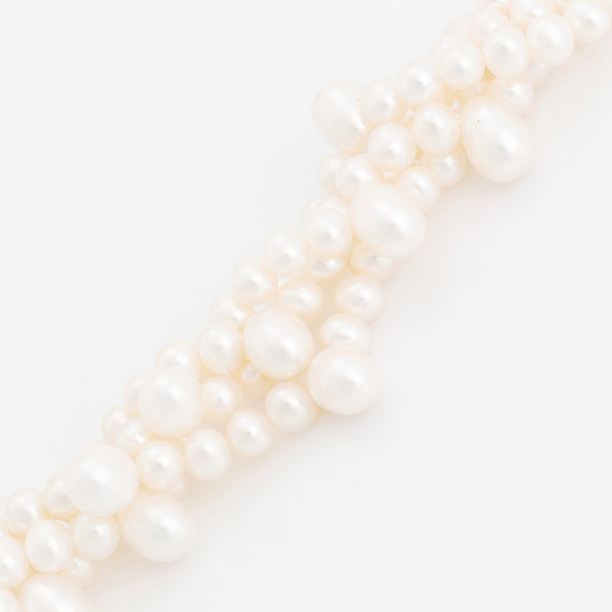 A cultured freshwater pearl necklace and bracelet.