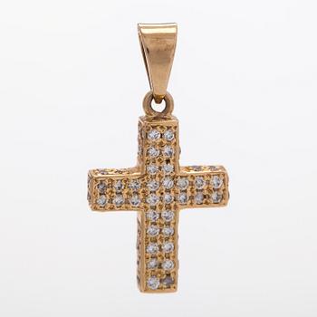A 14K gold cross pendant with diamonds.