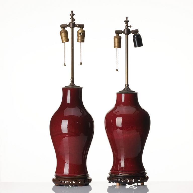 A set of two flambé glazed table lamps/vases, Qing dynasty, 19th century.