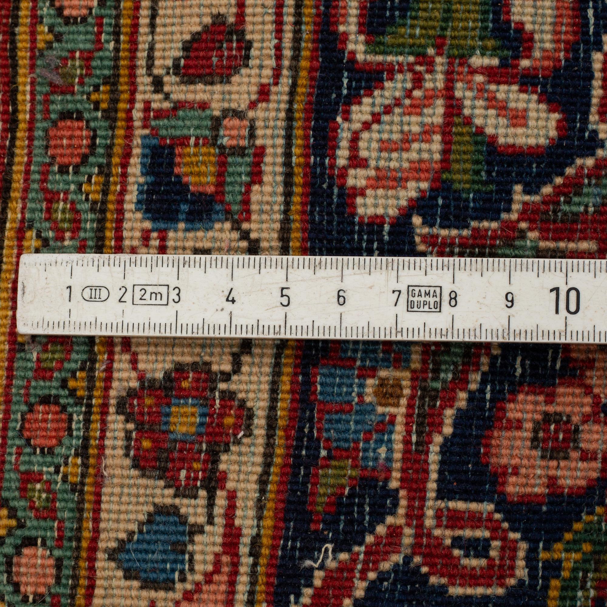 MATTO, a semi-antique Kashan, ca 207-209 x 136-137 cm.
