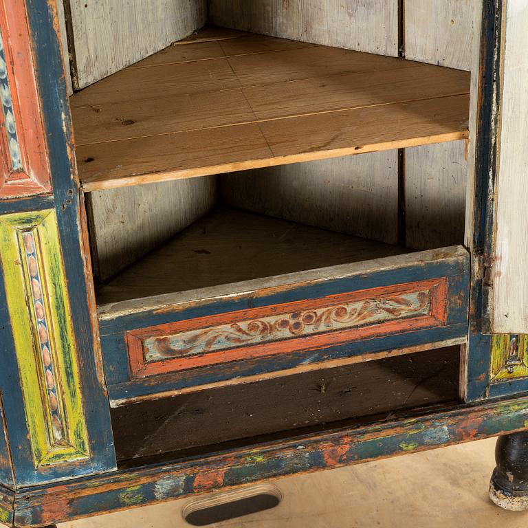 A SWEDISH CORNER CABINET, 1855.