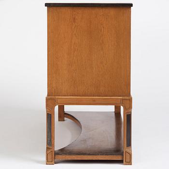 Carl Bergsten, an oak veneered sideboard/ chest of drawers, Nordiska Kompaniet Sweden 1923. Part of a set exhibited in Gothenburg 1923.