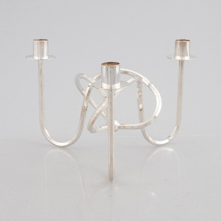 Josef Frank, candelabra, "The Knot of Friendship", silver-plated metal, Firma Svenskt Tenn.