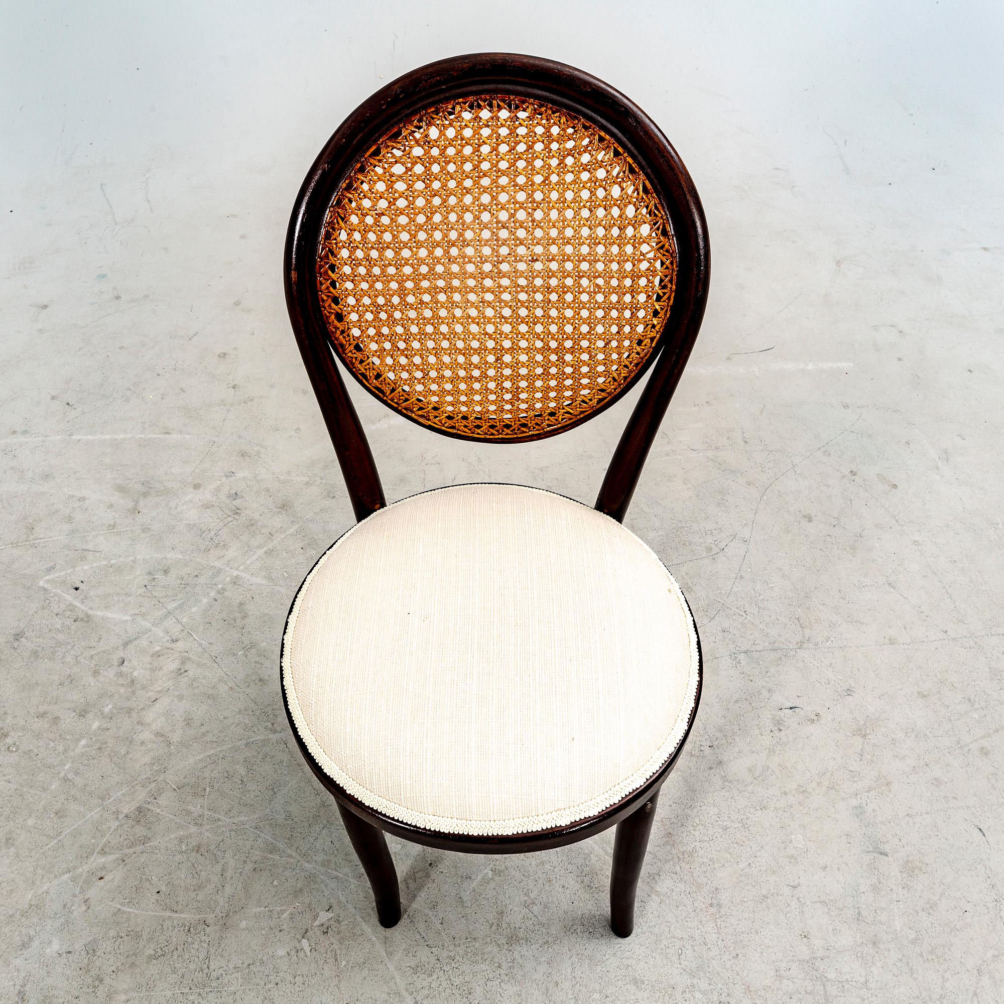 A set of four stained wood chairs, first half of the 20th century.
