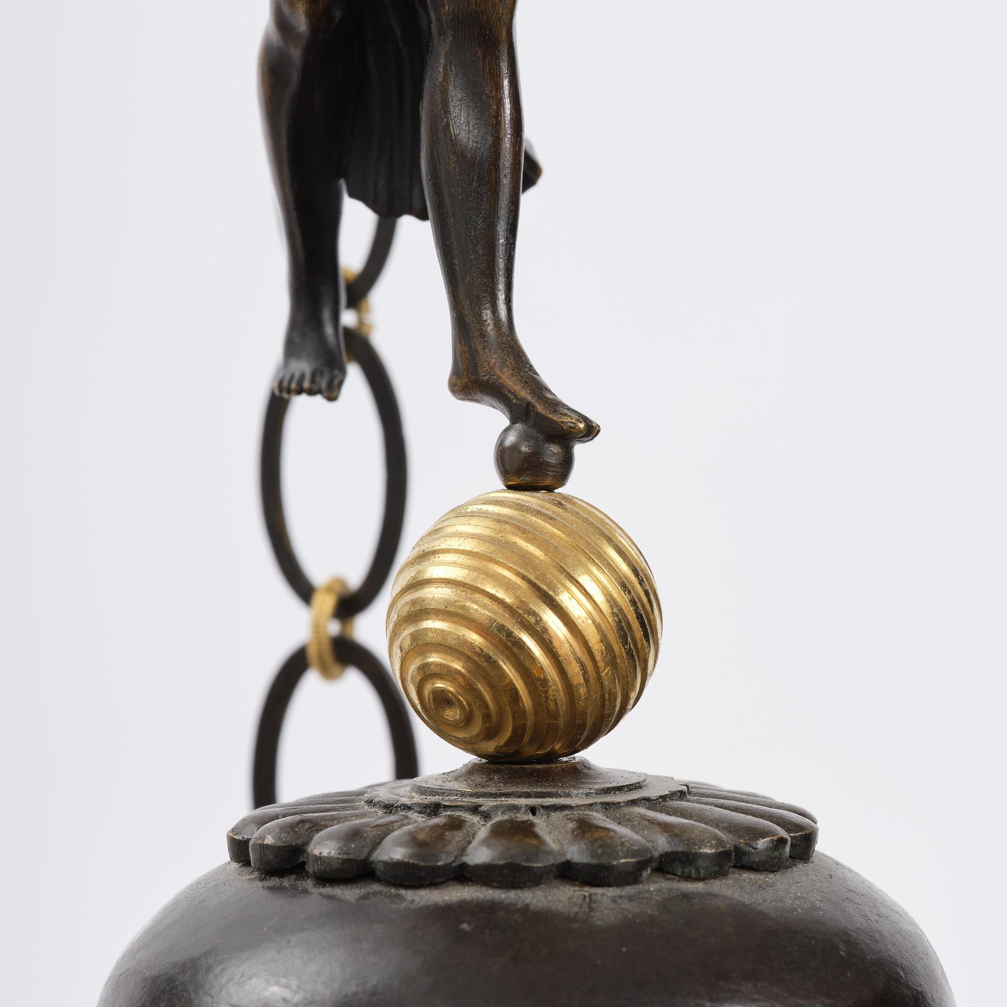 A patinated and ormolu six-light Empire chandelier, Stockholm, first part 19th century.