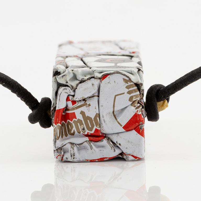 César Baldaccini, compression, pendant made of compressed beer bottle caps.