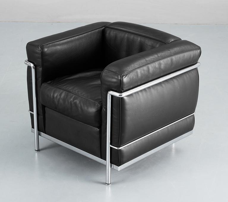 A pair of Le Corbusier 'LC 2' black leather and chromed steel easy chairs, Cassina, Italy.