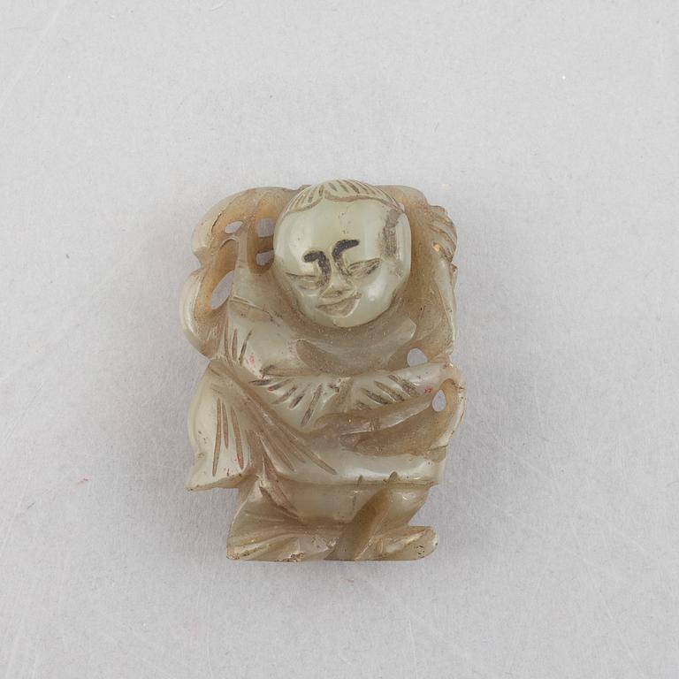 A group of four Chinese stone charms, 20th century.