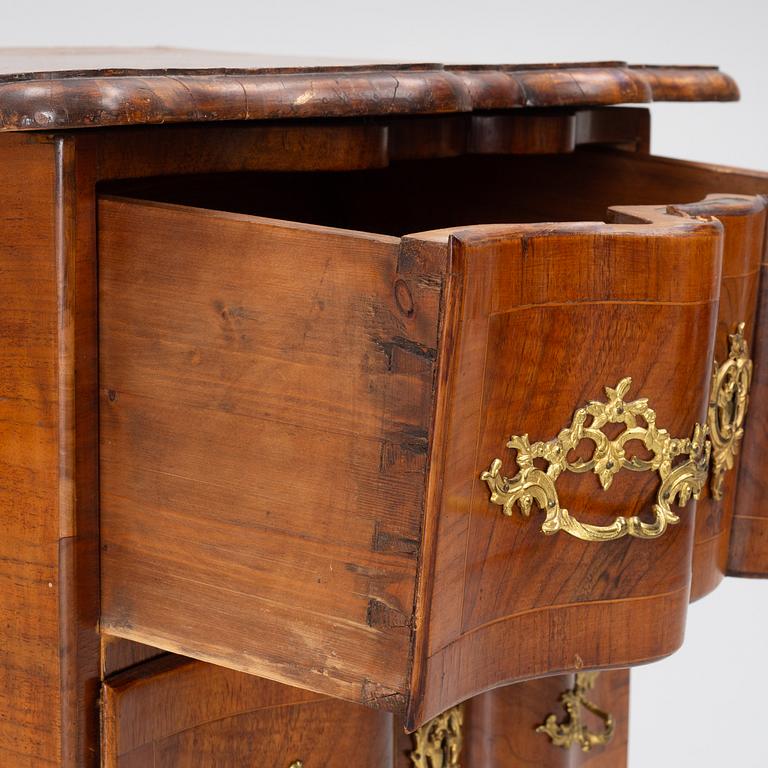 A Rococo-style chest of drawers, 19th century.
