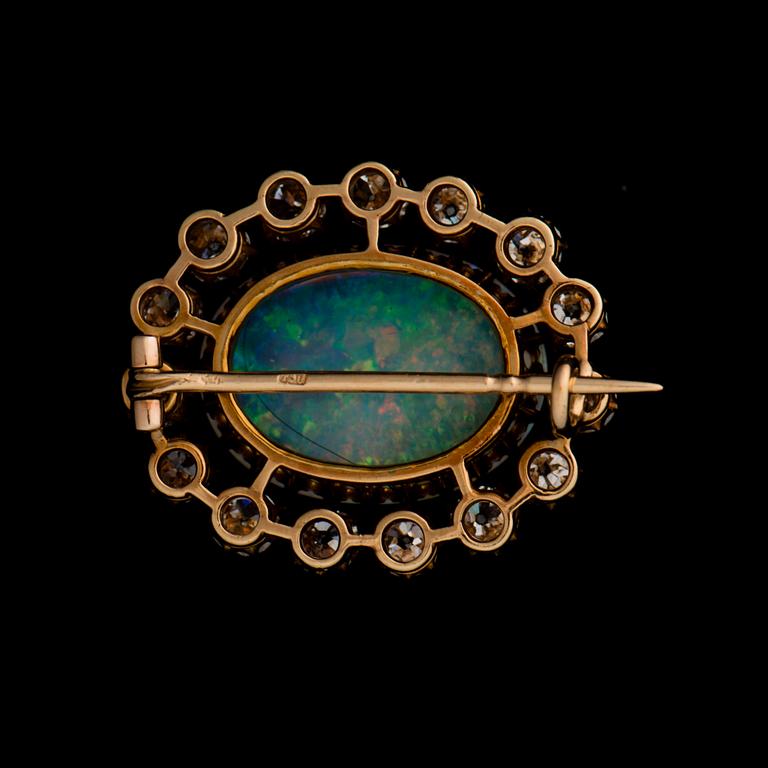 A BROOCH, opal, old cut diamonds, 18K gold.