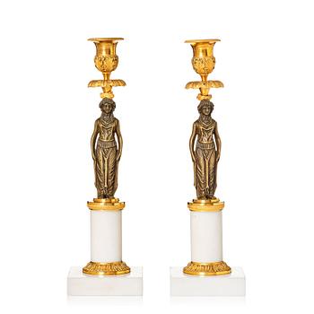 A pair of late Gustavian ormolu, patinated bronze, and marble candlessticks attributed to F. L. Rung (1758-1837).