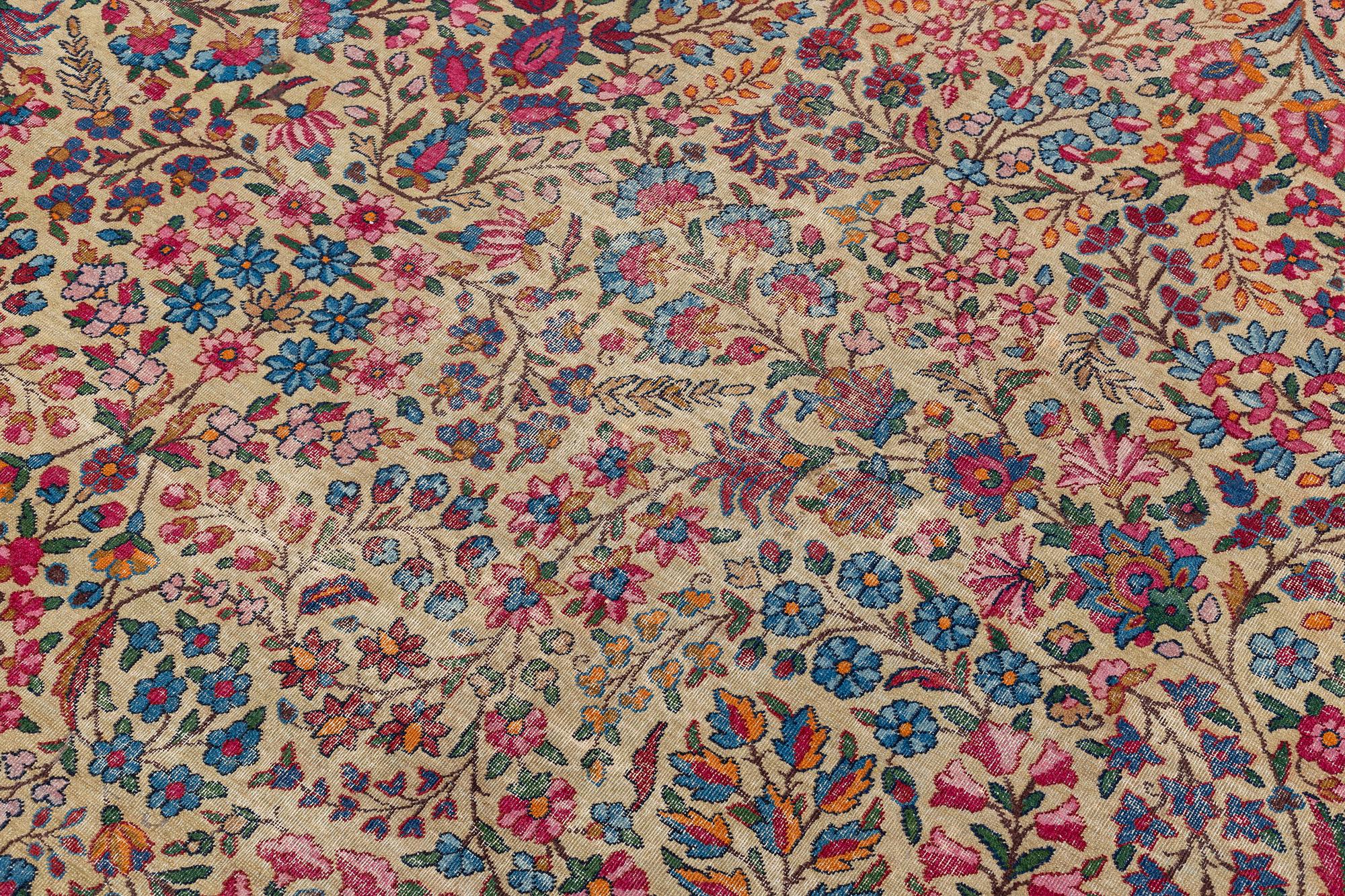 An antique 'Millefleur' Kerman Laver carpet, ca 434 x 321 cm.