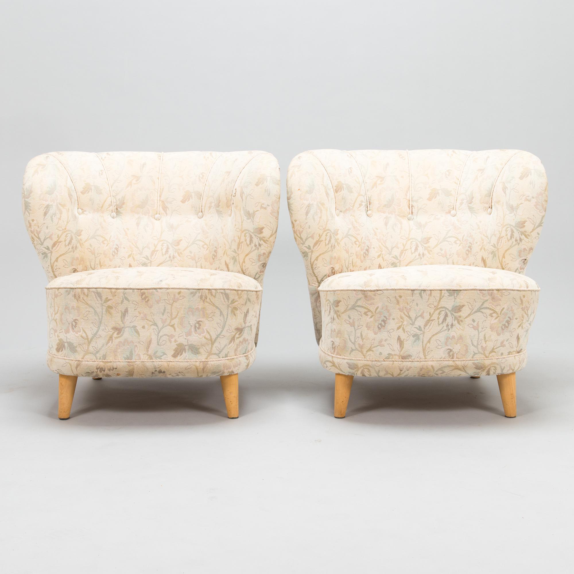 A pair of mid 20th century armchairs.
