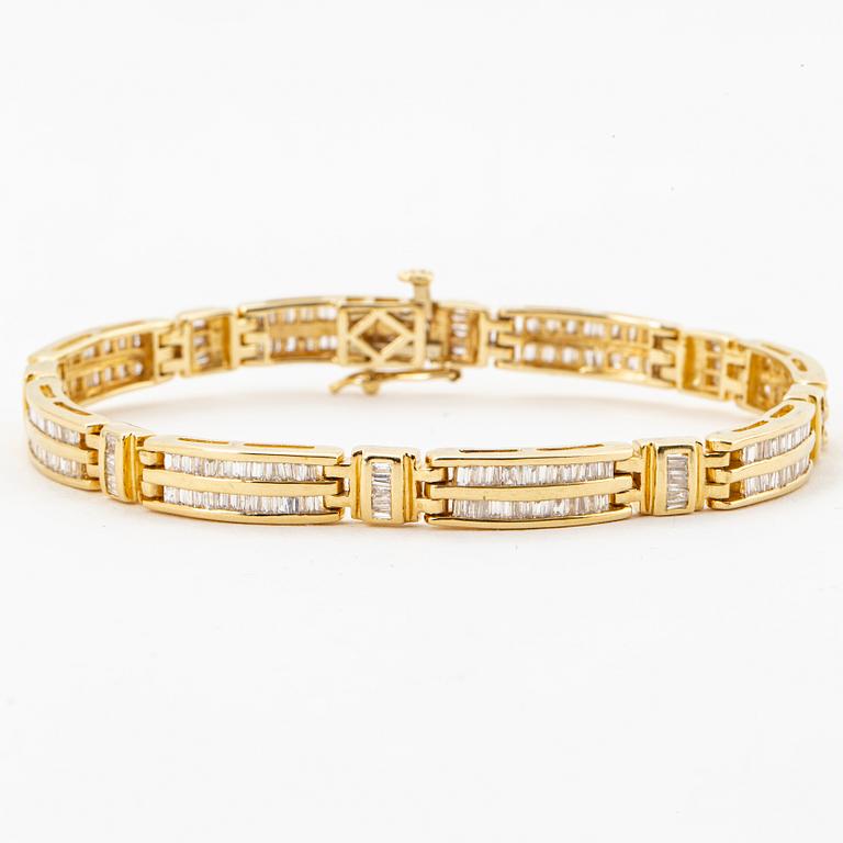 14K gold and small modified baguette cut diamond bracelet.