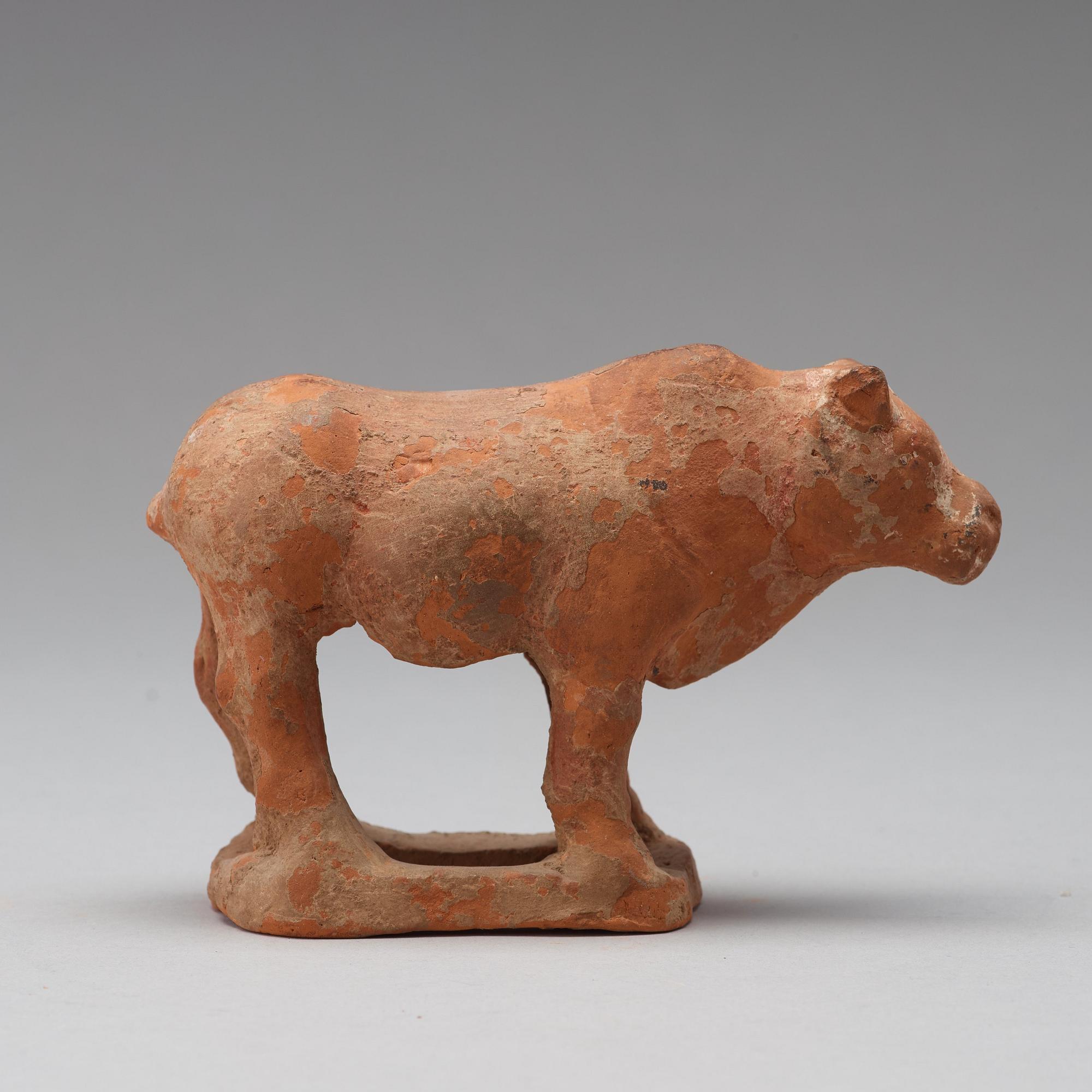 Three pottery scultpures of animals and a herdsman, Tang dynasty (618-906).