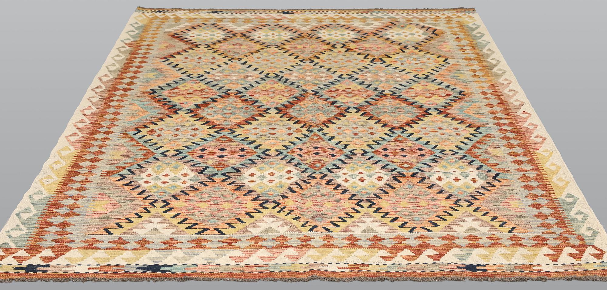 A Kilim rug, c. 249 x 169 cm.