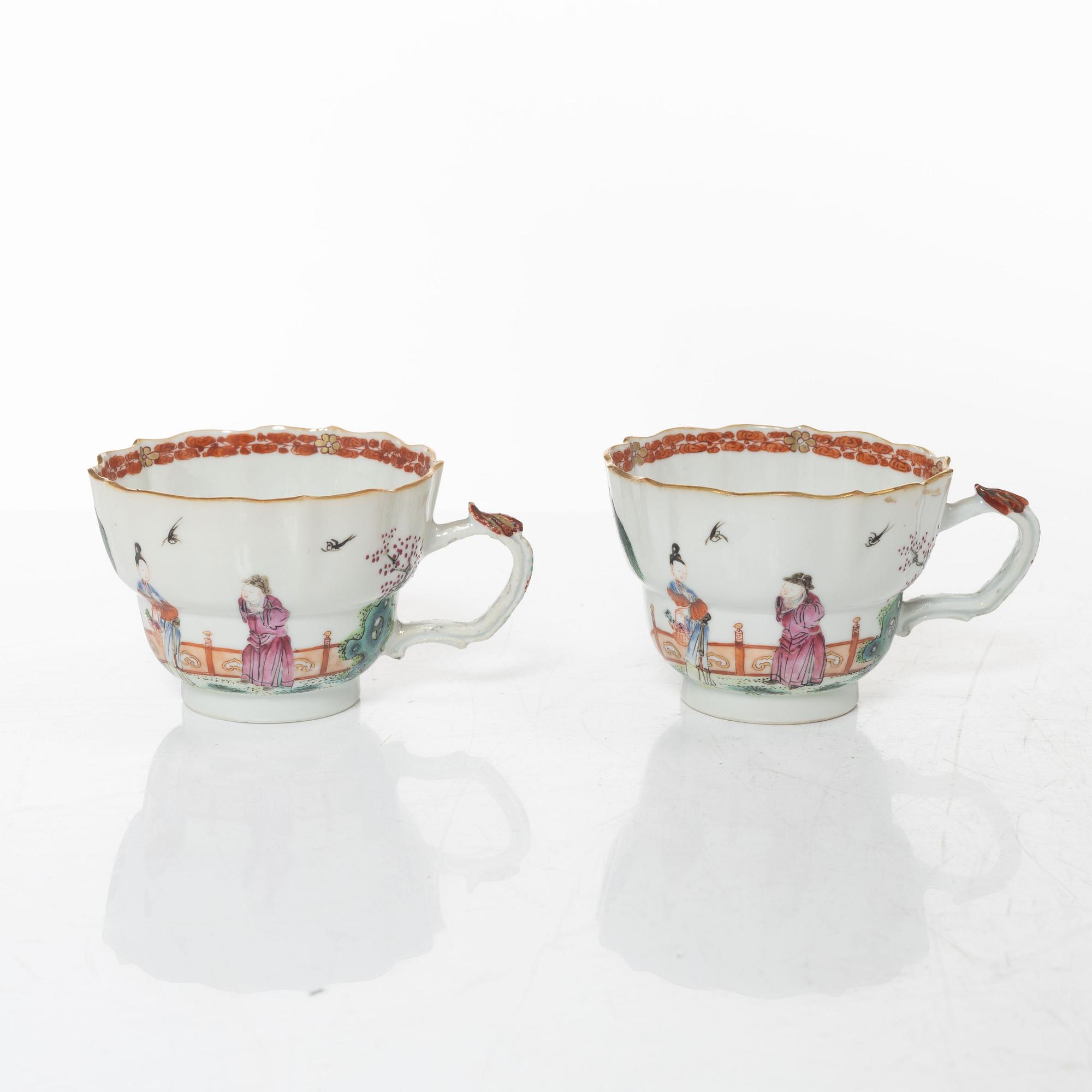 A pair of Chinese famille rose teacups with saucers and a pair of plates and two dishes, Qing dynasty, 18th century.