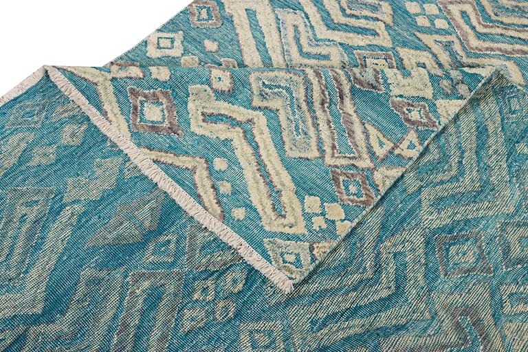 A Moroccan carpet, c. 398 x 200 cm.