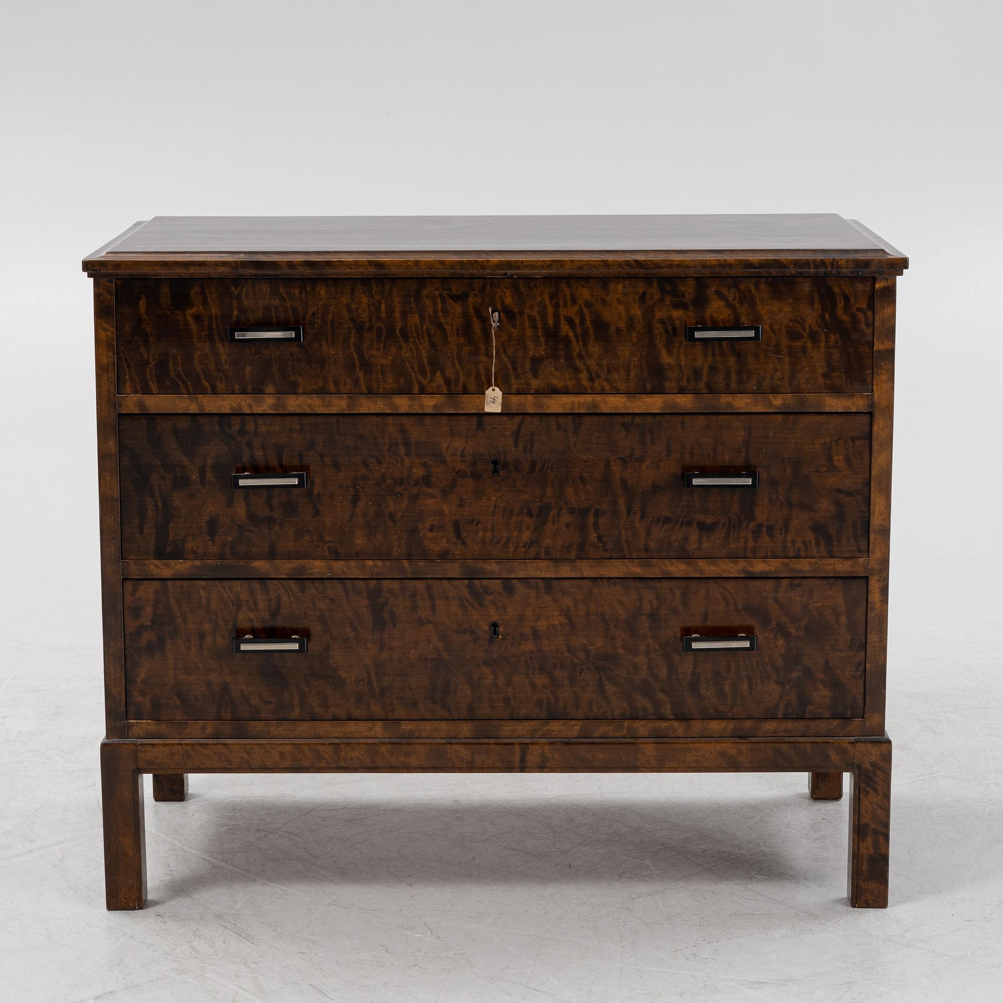 A 1930's stained birch chest of drawers.
