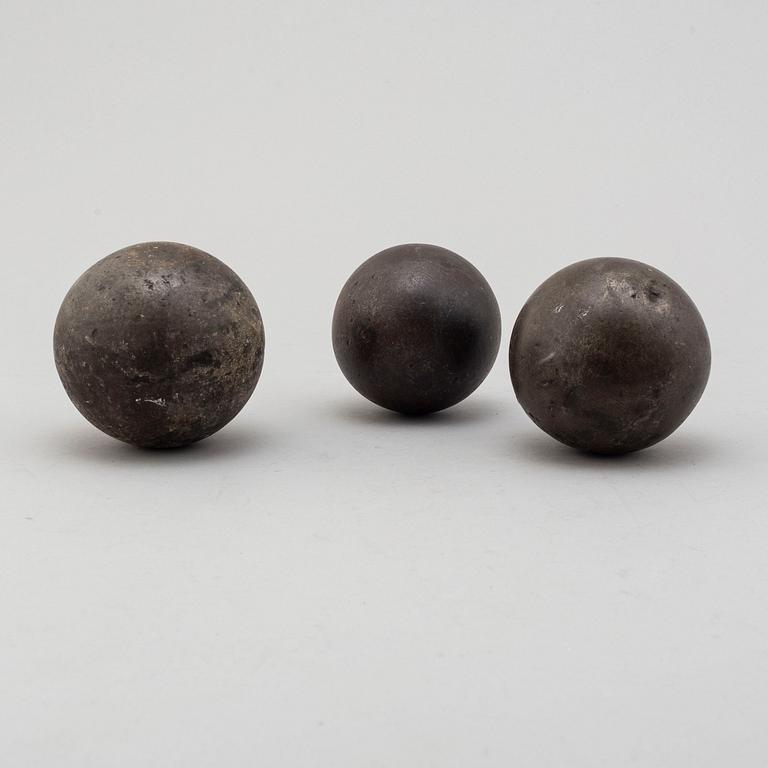 Three 19th century iron balls.