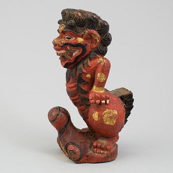 A wooden sculpture of a deity, India, circa 1900.