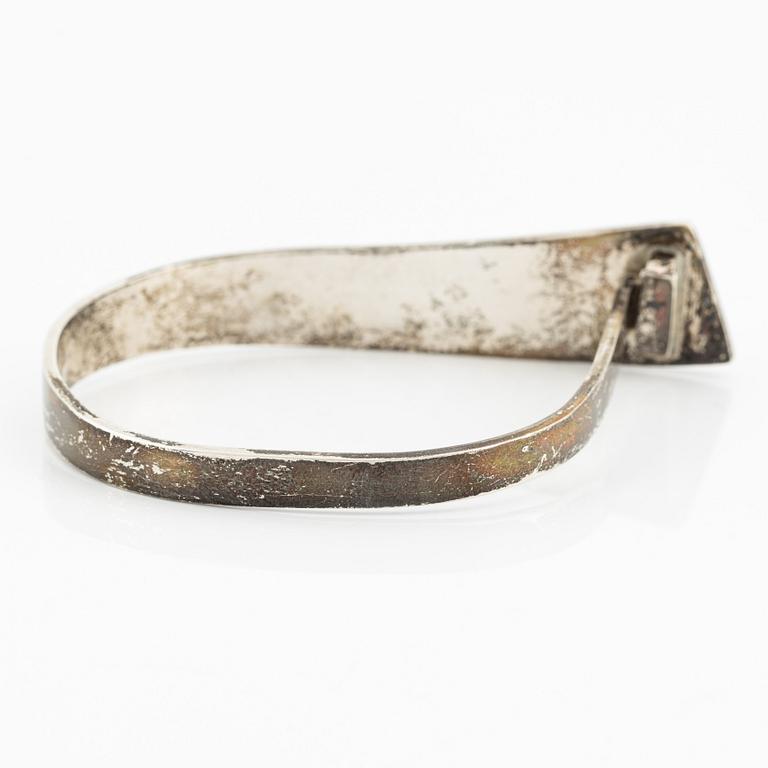 Rey Urban,  silver bangle.