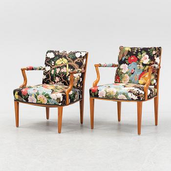 Josef Frank, two mahogany and rattan armchairs, model 969, Firma Svenskt Tenn.