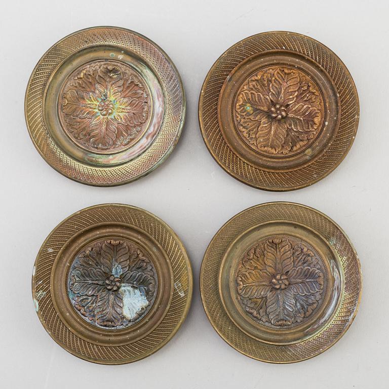 A SET OF FOUR BRONZE EMPIRE CURTAIN TIE-BACKS, first half of the 19th century.