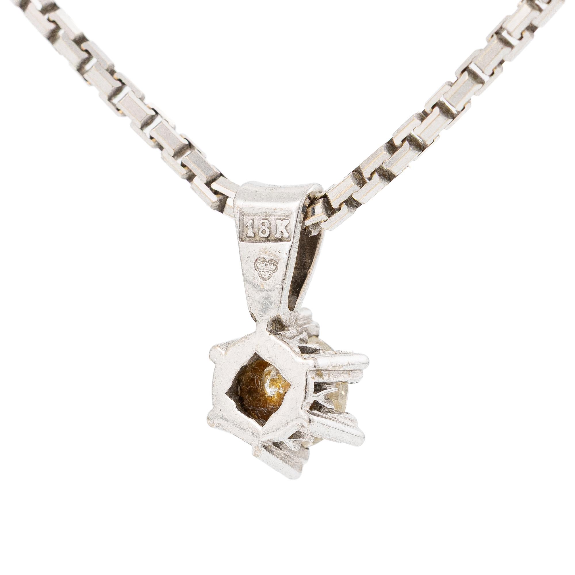 Pendant with chain in the shape of a star with a brilliant-cut diamond.