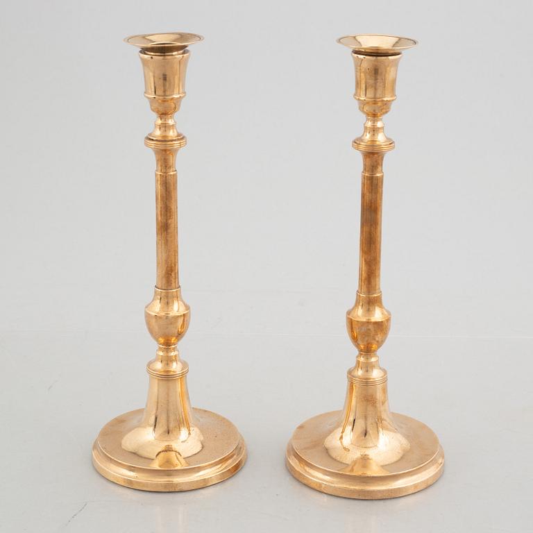 Two pairs of brass candlesticks, 19th century - early 20th century.